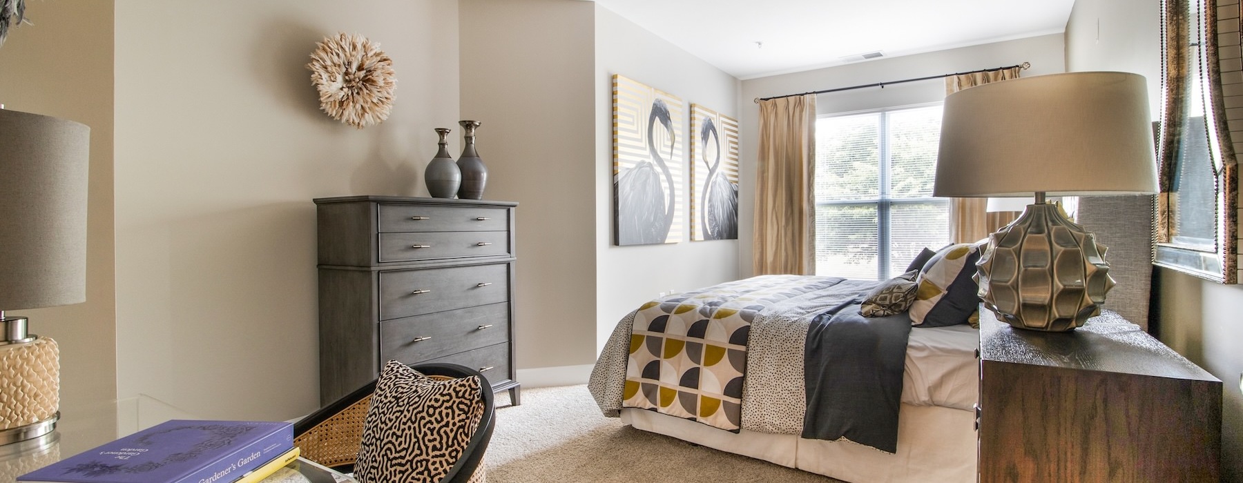 a bedroom with a bed and a chair