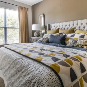 a bed with a colorful blanket